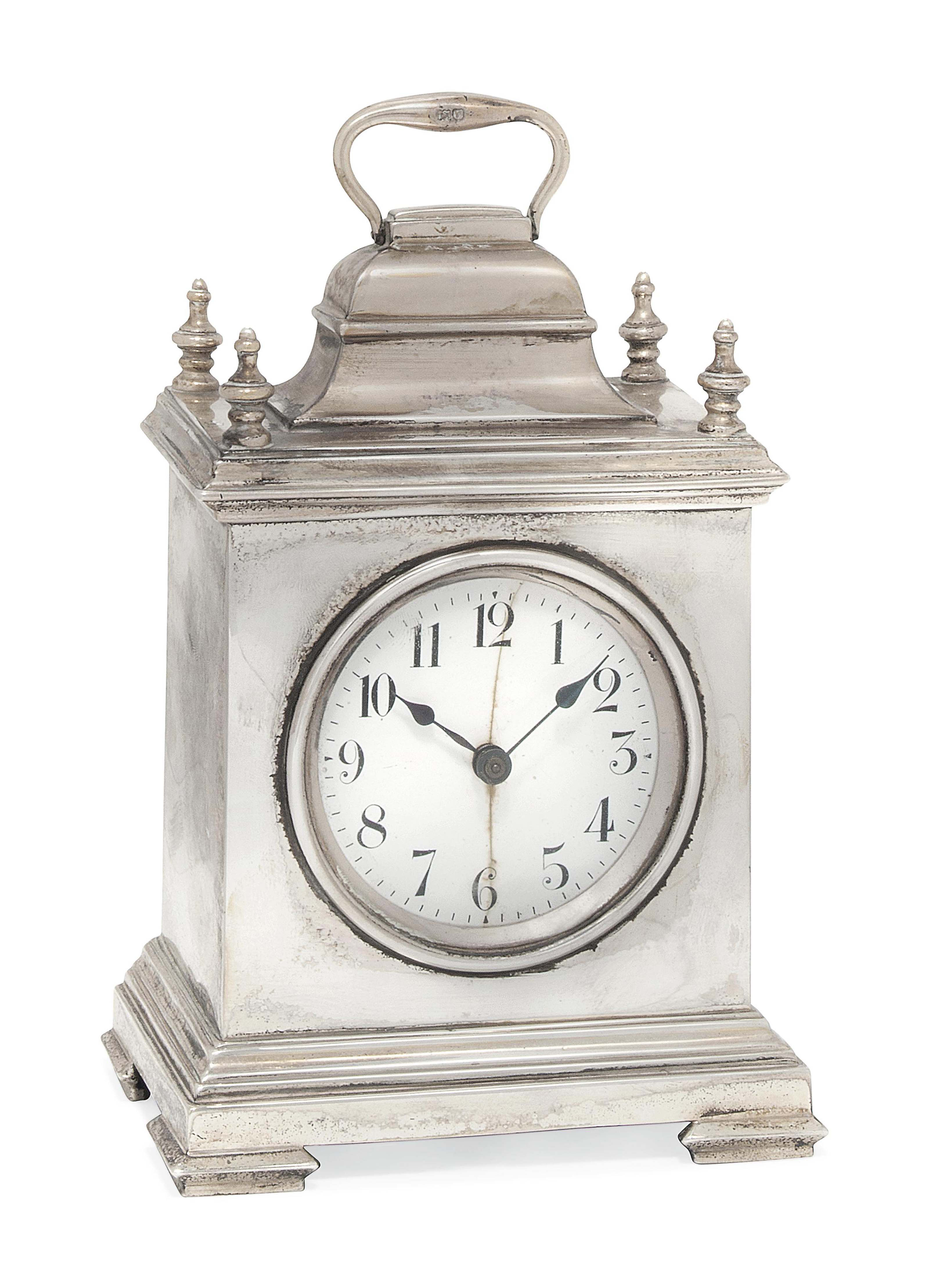 A SILVERCASED MANTEL CLOCK , MARK OF WILLIAM COMYNS, LONDON, 1912